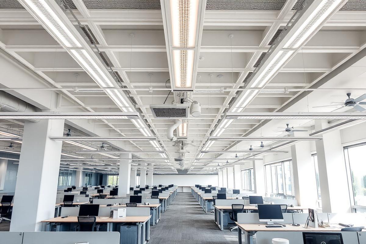 Placeholder image: modern open plan office with newly installed suspended linear LED lighting